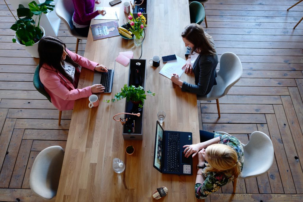 Office employees sitting at an office table